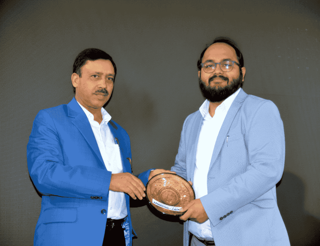 Dr. Vinit Patel receiving an award at a professional event