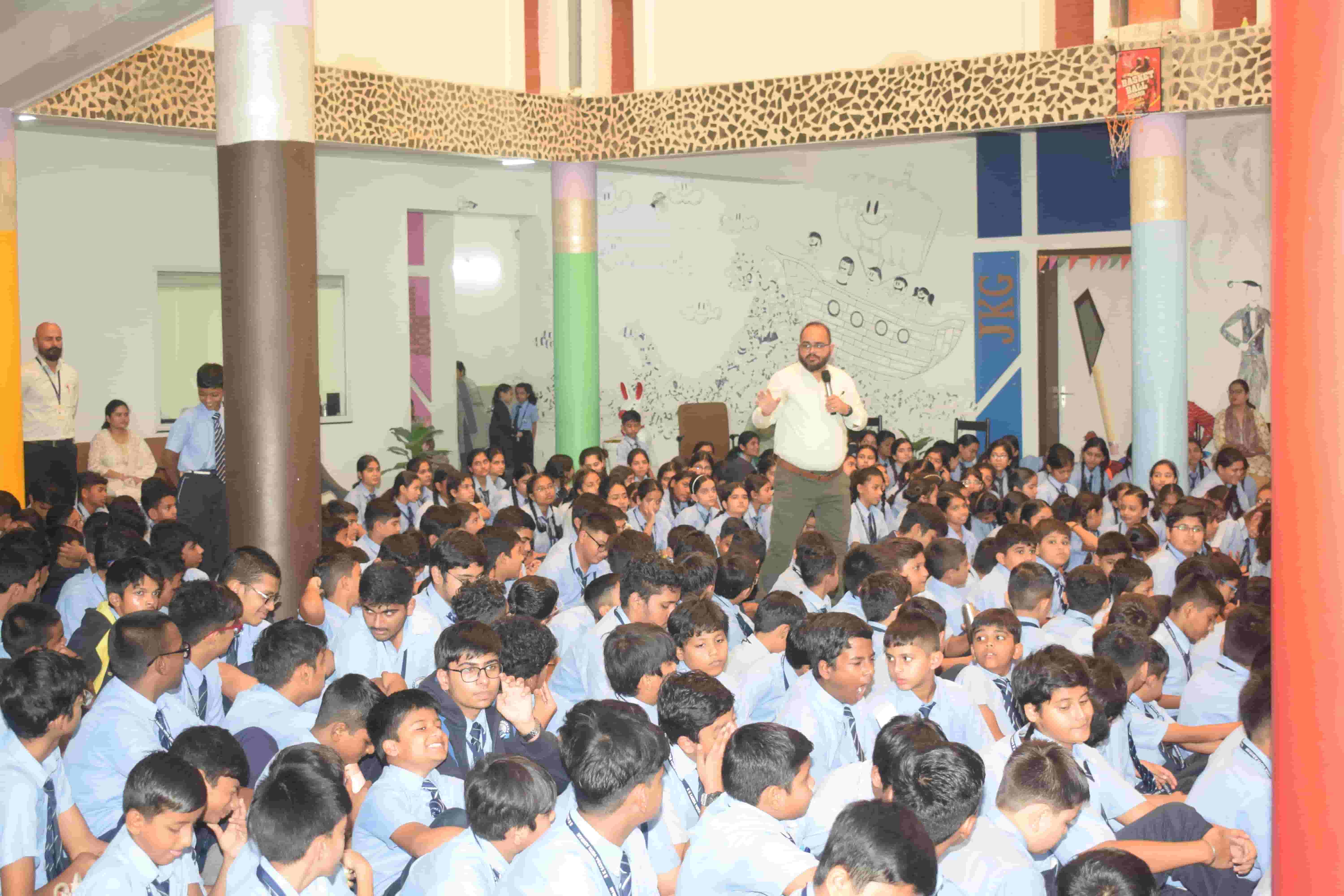 Dr. Vinit Patel addressing school students during a mental health awareness session